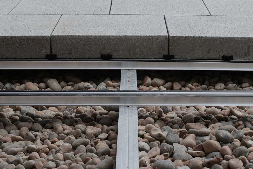 Paving on rail system